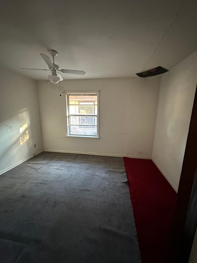 empty room featuring ceiling fan and carpet floors