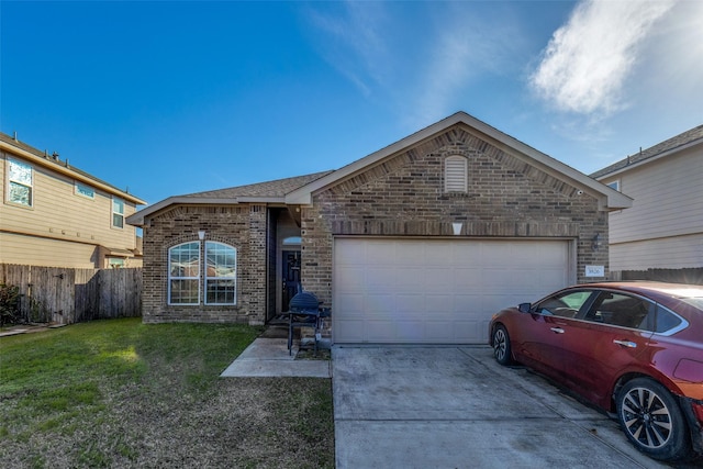 single story home featuring a garage and a front lawn