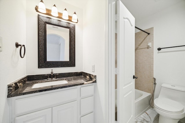 full bathroom featuring vanity, toilet, and tiled shower / bath combo