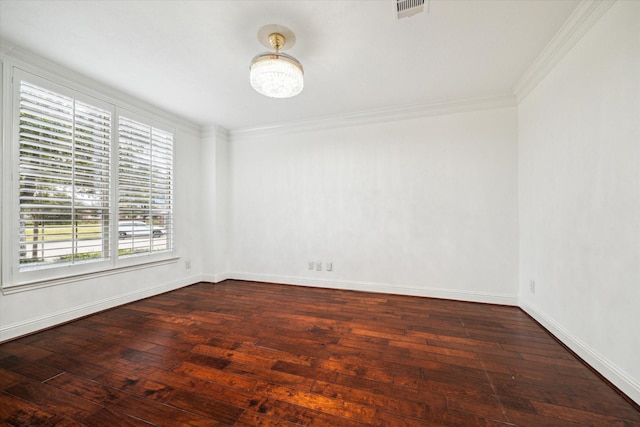 unfurnished room with dark wood-type flooring and ornamental molding