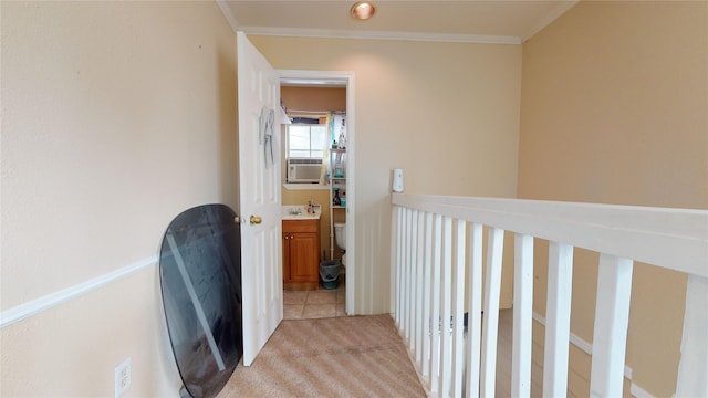 hall featuring light tile patterned flooring, ornamental molding, and cooling unit