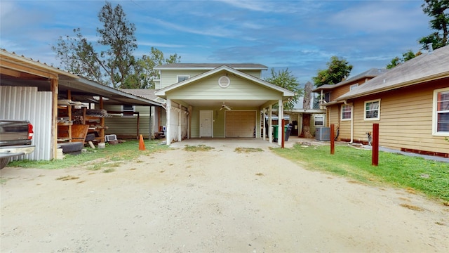 bungalow featuring a carport and cooling unit