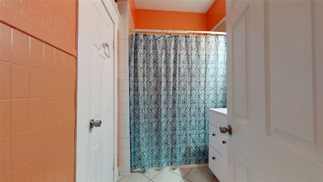 bathroom with tile patterned floors