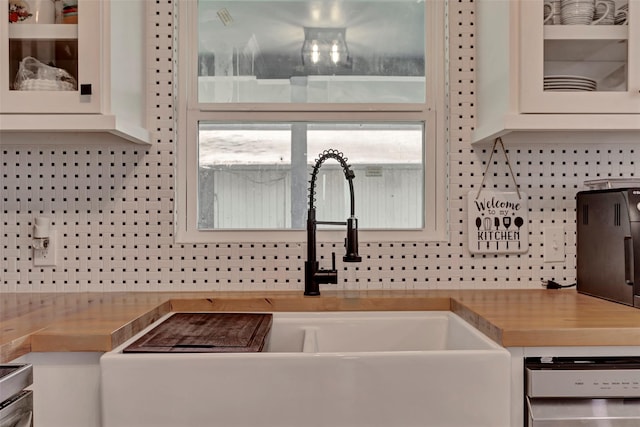 354 Edgewater Way, Point Blank, TX 77364 - kitchen featuring a sink, dishwasher, glass insert cabinets, and white cabinets