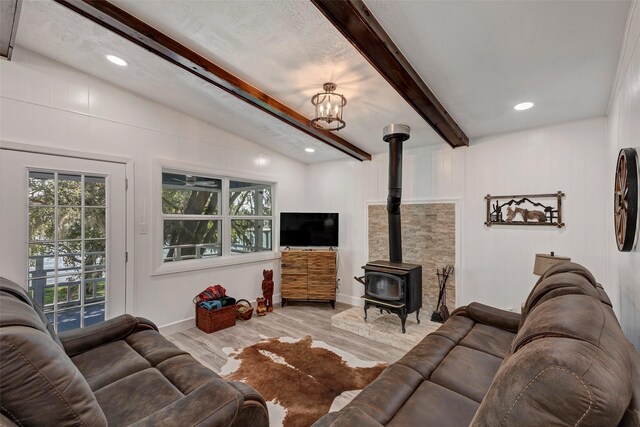 354 Edgewater Way, Point Blank, TX 77364 - living area featuring a wood stove, wood finished floors, a chandelier, recessed lighting, and baseboards