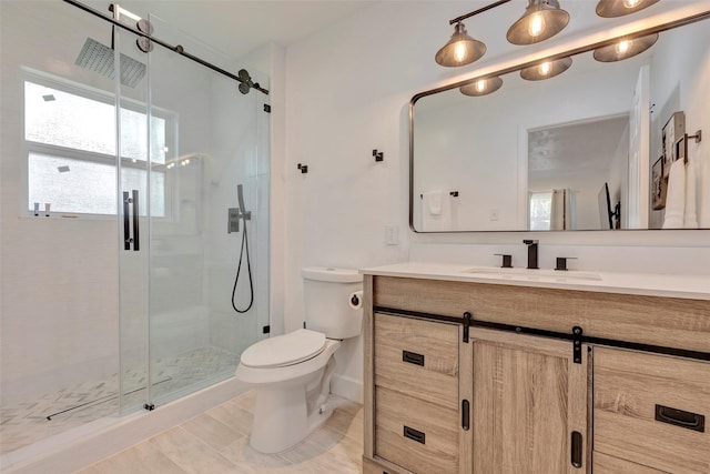 bathroom featuring an enclosed shower, vanity, tile patterned flooring, and toilet