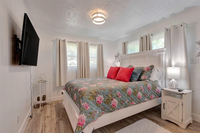 bedroom with hardwood / wood-style flooring