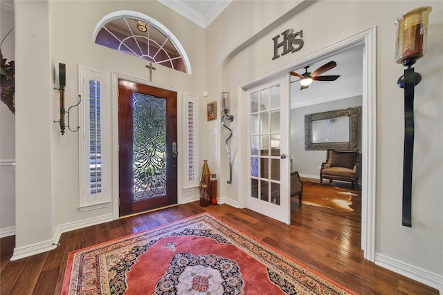 entryway featuring dark hardwood / wood-style floors, ceiling fan, and ornamental molding