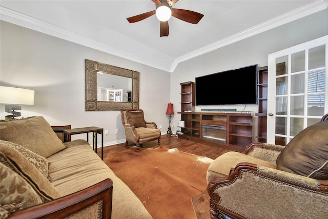 living room with crown molding, vaulted ceiling, ceiling fan, a fireplace, and wood-type flooring