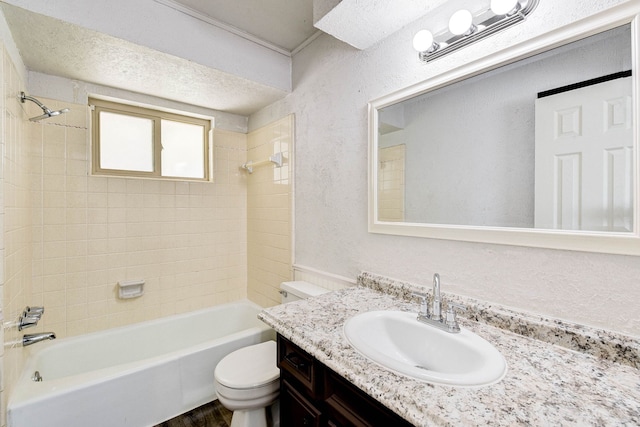 full bathroom with hardwood / wood-style floors, vanity, toilet, and tiled shower / bath