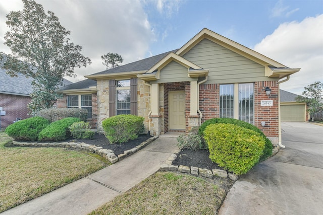 bungalow with a garage and a front lawn