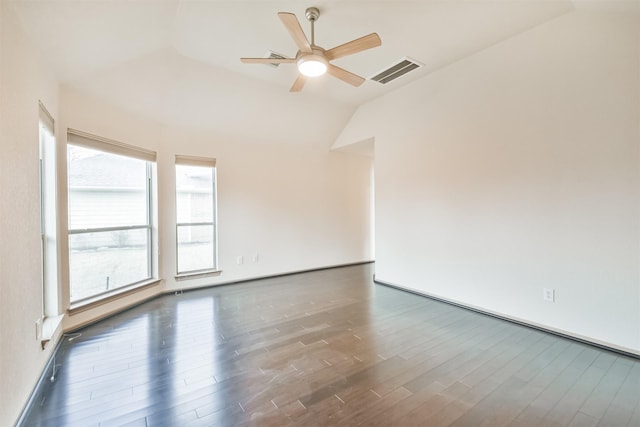 unfurnished room featuring ceiling fan, dark hardwood / wood-style flooring, and vaulted ceiling