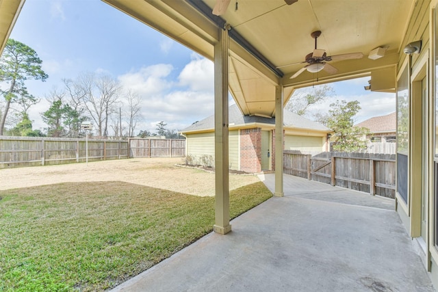 view of patio with ceiling fan and a storage shed