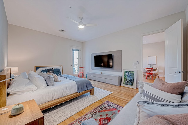 bedroom with ceiling fan and wood-type flooring