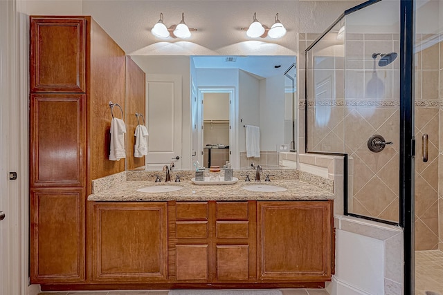 bathroom with vanity and walk in shower