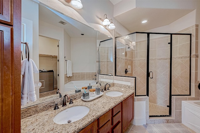 bathroom with tile patterned floors, vanity, and independent shower and bath