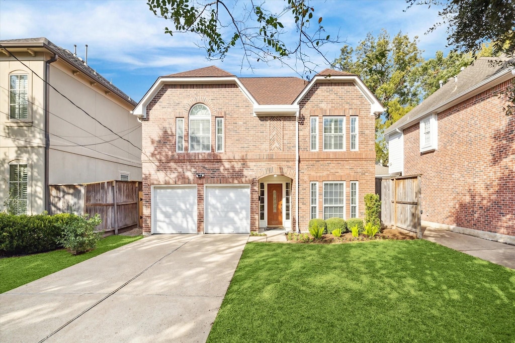 front facade with a front yard and a garage