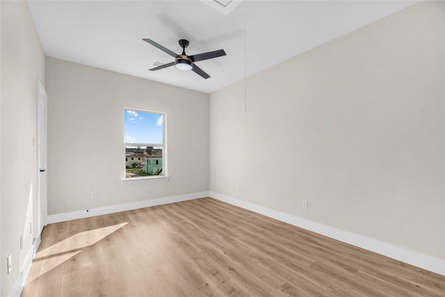 unfurnished room featuring light wood-type flooring and ceiling fan