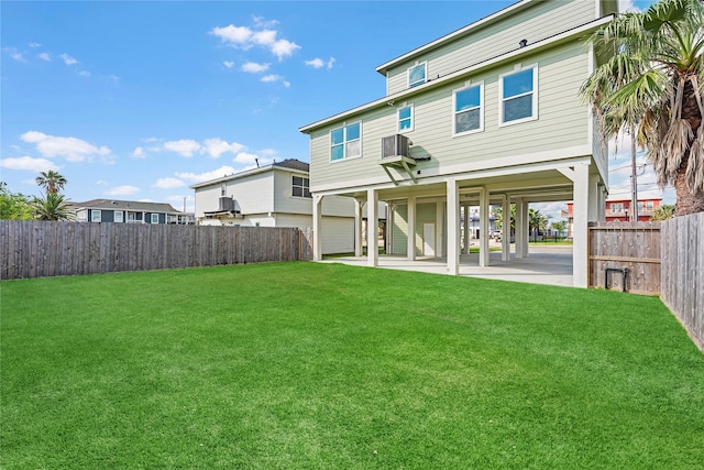 rear view of property with a lawn and a patio area