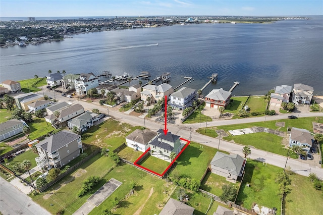 birds eye view of property featuring a water view