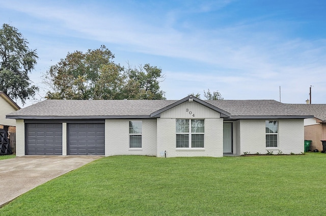 ranch-style house with a front yard and a garage