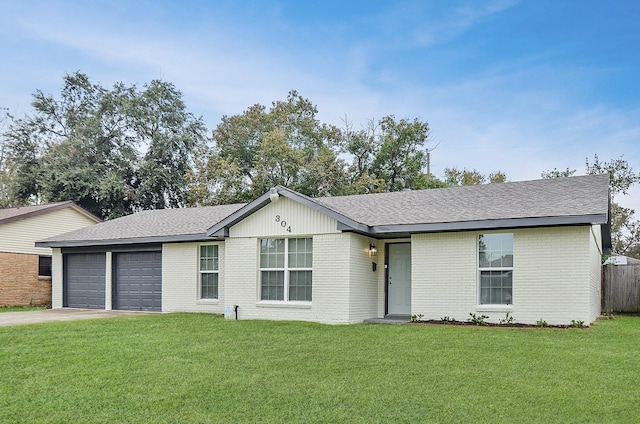 ranch-style home featuring a front yard and a garage