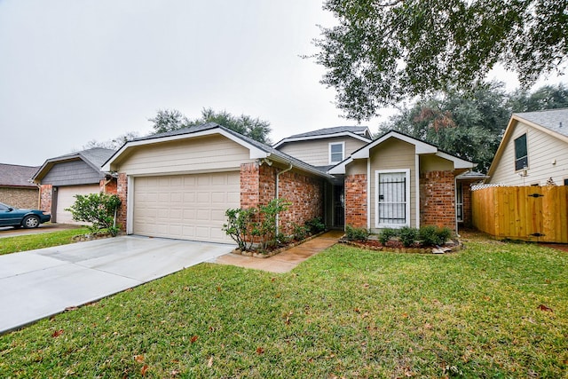 view of front of house featuring a front yard and a garage