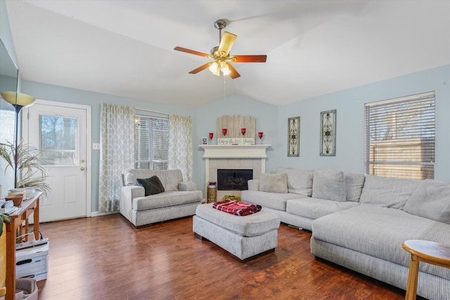 living room featuring a fireplace, dark wood-type flooring, ceiling fan, and lofted ceiling