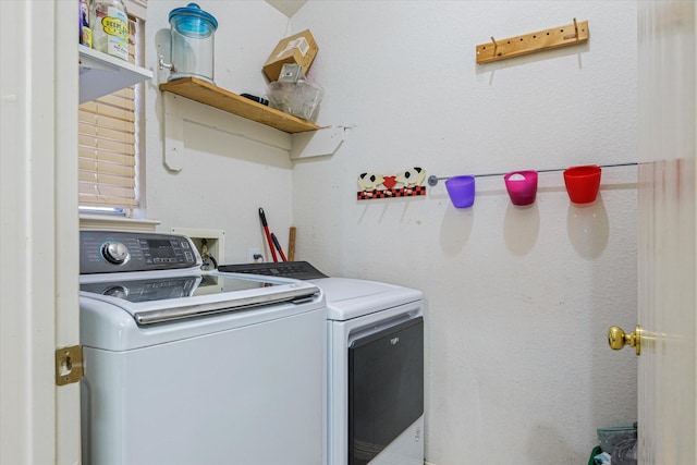 washroom featuring washing machine and dryer