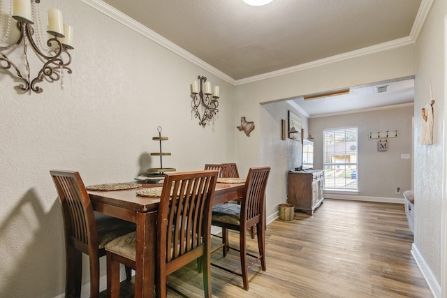 dining room featuring ornamental molding and hardwood / wood-style floors