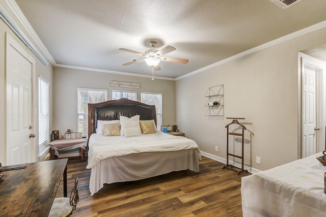 bedroom featuring ceiling fan, dark hardwood / wood-style floors, ornamental molding, and a textured ceiling