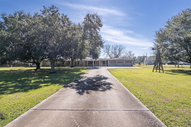 view of property's community with a lawn