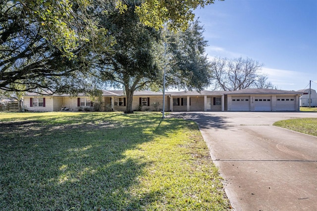 ranch-style home with a front yard and a garage