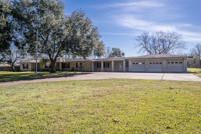 ranch-style home featuring a garage and a front lawn