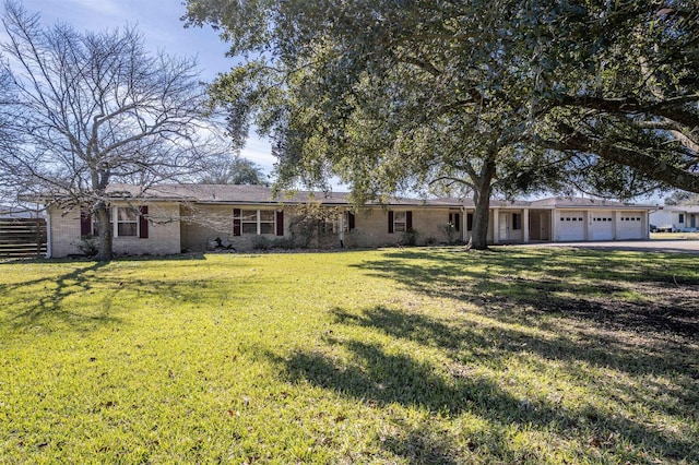 ranch-style house with a front lawn and a garage