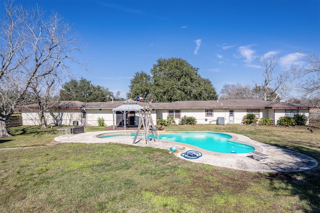 view of swimming pool with a gazebo and a yard