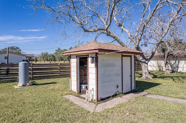 view of outdoor structure featuring a lawn