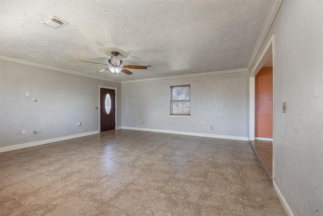 interior space featuring ceiling fan, ornamental molding, a textured ceiling, and light tile patterned floors