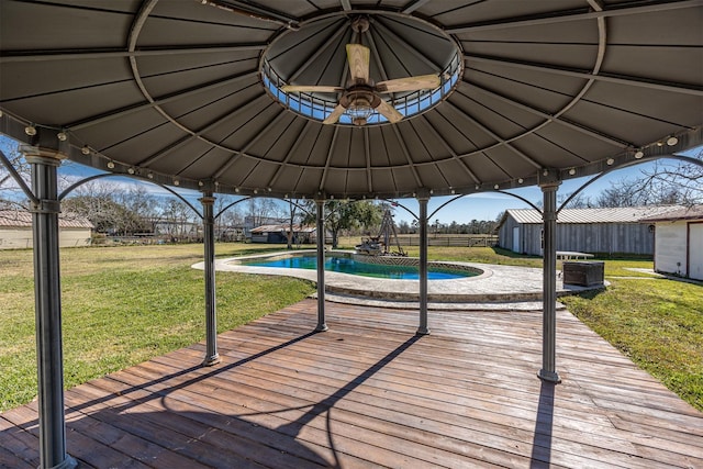 deck featuring a gazebo and a lawn