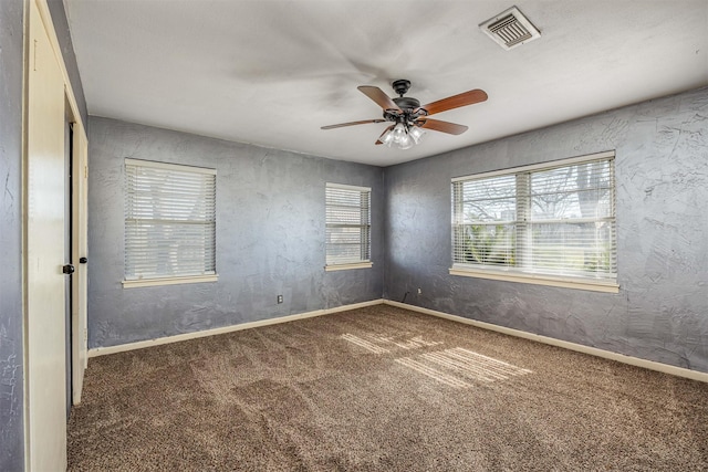 carpeted empty room with ceiling fan