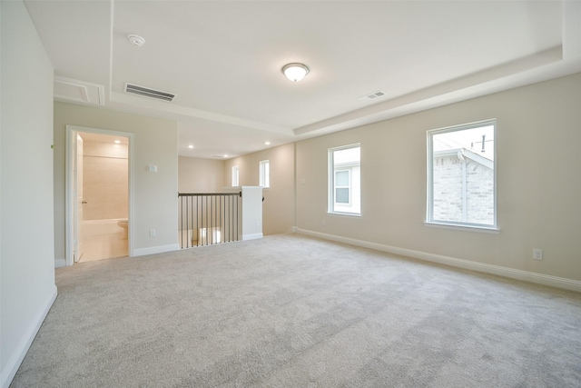 carpeted empty room with plenty of natural light, recessed lighting, baseboards, and a smoke detector