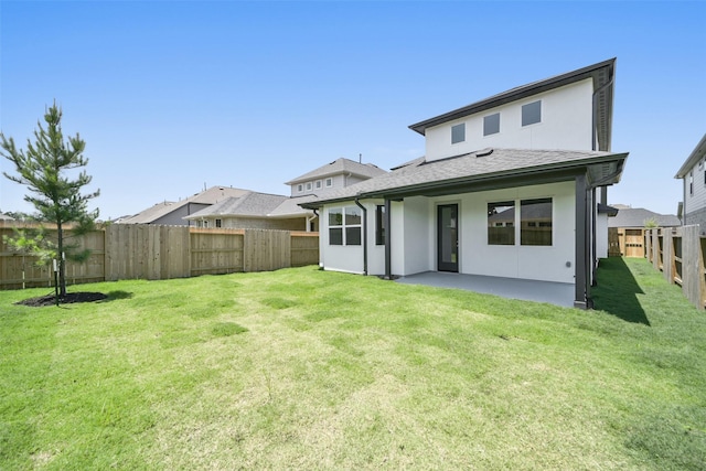 back of property with stucco siding, a patio area, and a shingled roof