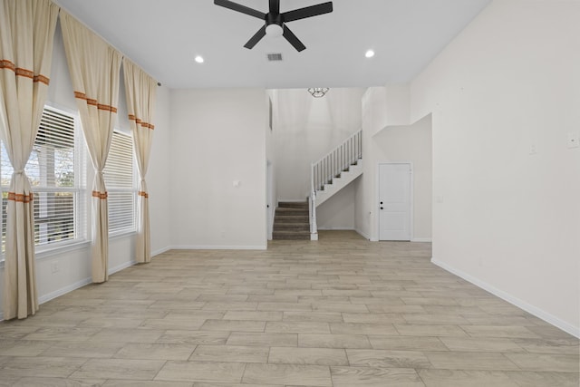 unfurnished living room with ceiling fan and light hardwood / wood-style floors