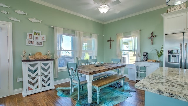 dining space featuring ceiling fan, a healthy amount of sunlight, crown molding, and dark wood-type flooring