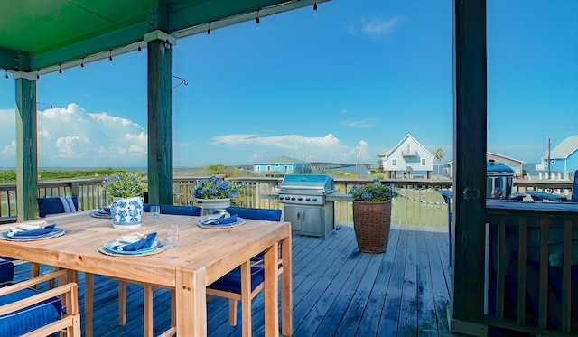 wooden deck featuring grilling area