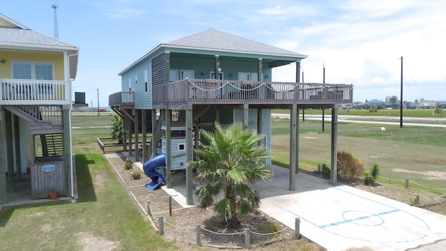 back of property featuring a yard