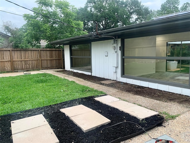 doorway to property featuring a yard