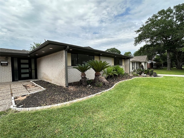 view of home's exterior with a yard