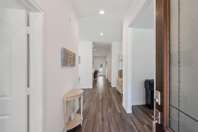 corridor featuring dark hardwood / wood-style floors