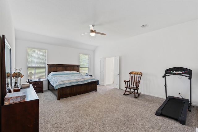 bedroom with lofted ceiling, light colored carpet, and ceiling fan